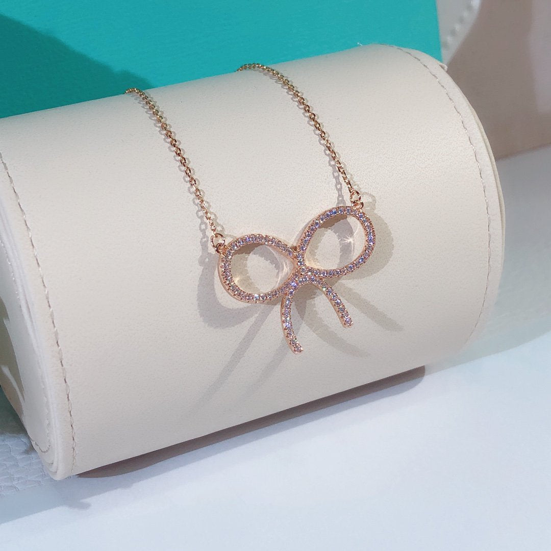 [Lioran]CLAW SET RHODIUM PLATED BOW NECKLACE