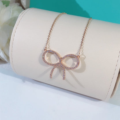 [Lioran]CLAW SET RHODIUM PLATED BOW NECKLACE