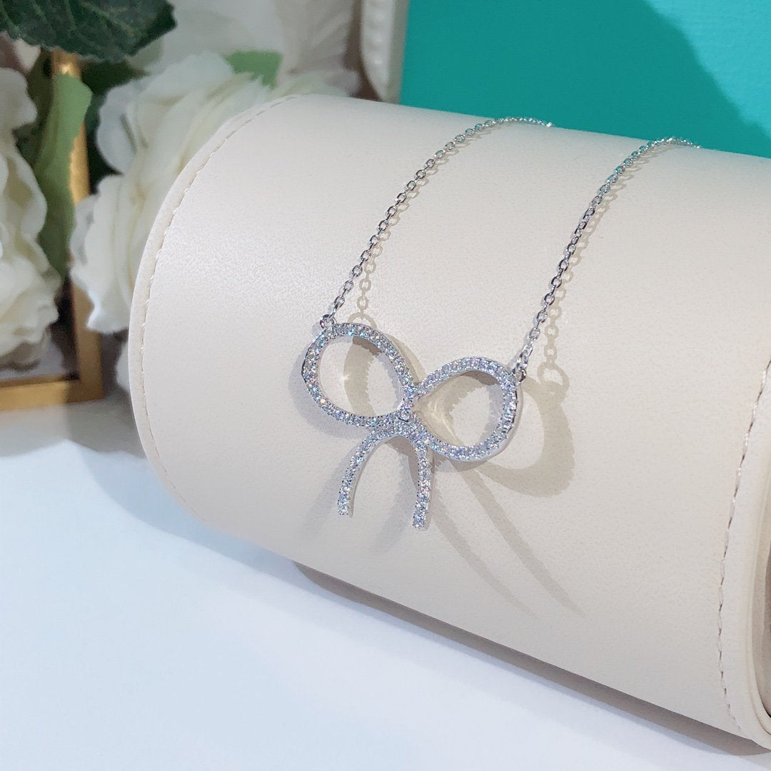[Lioran]CLAW SET RHODIUM PLATED BOW NECKLACE