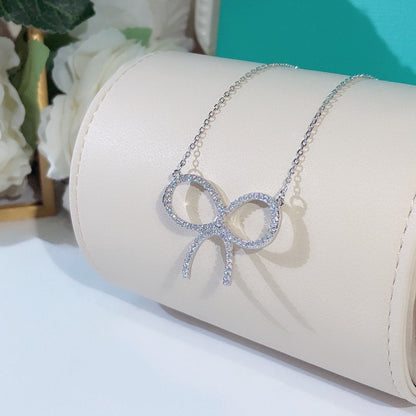 [Lioran]CLAW SET RHODIUM PLATED BOW NECKLACE